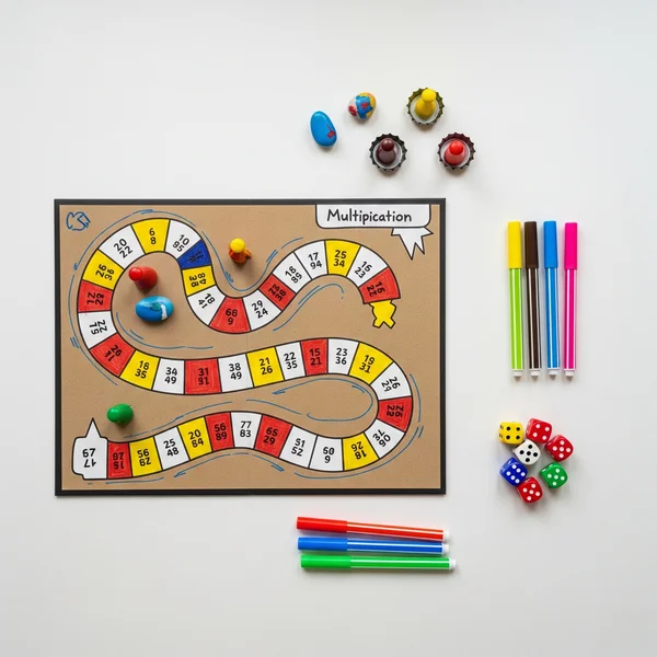 Hand-drawn multiplication board game with colorful pieces